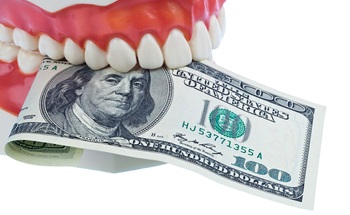 Dental model biting $100 bill