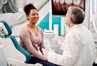 woman talking to cosmetic dentist in San Antonio  