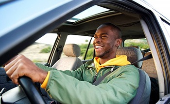 Man drives with a smile