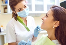 Implant dentist in San Antonio speaking with a patient