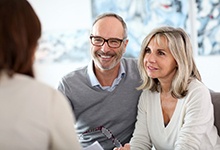 couple at a dental implant consultation 