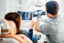 San Antonio dentist explaining X-ray to patient 