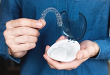 Teen patient in San Antonio showing off Invisalign Teen  