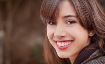 A young girl smiling