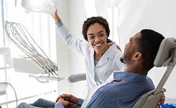 Dentist examining patient's teeth