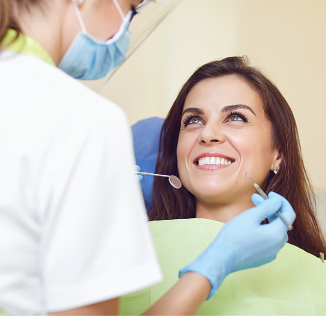 Woman smiling at her dental hygienist