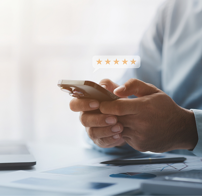 Person leaving a five star review on their phone