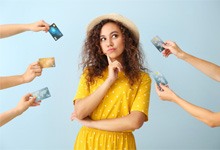 Woman surrounded by credit cards