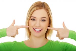 Woman pointing at smile