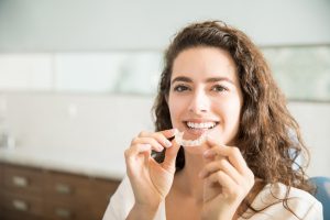 Woman enjoying the benefits of Invisalign. 