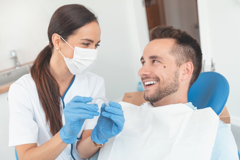 A dentist explaining the Invisalign timeline